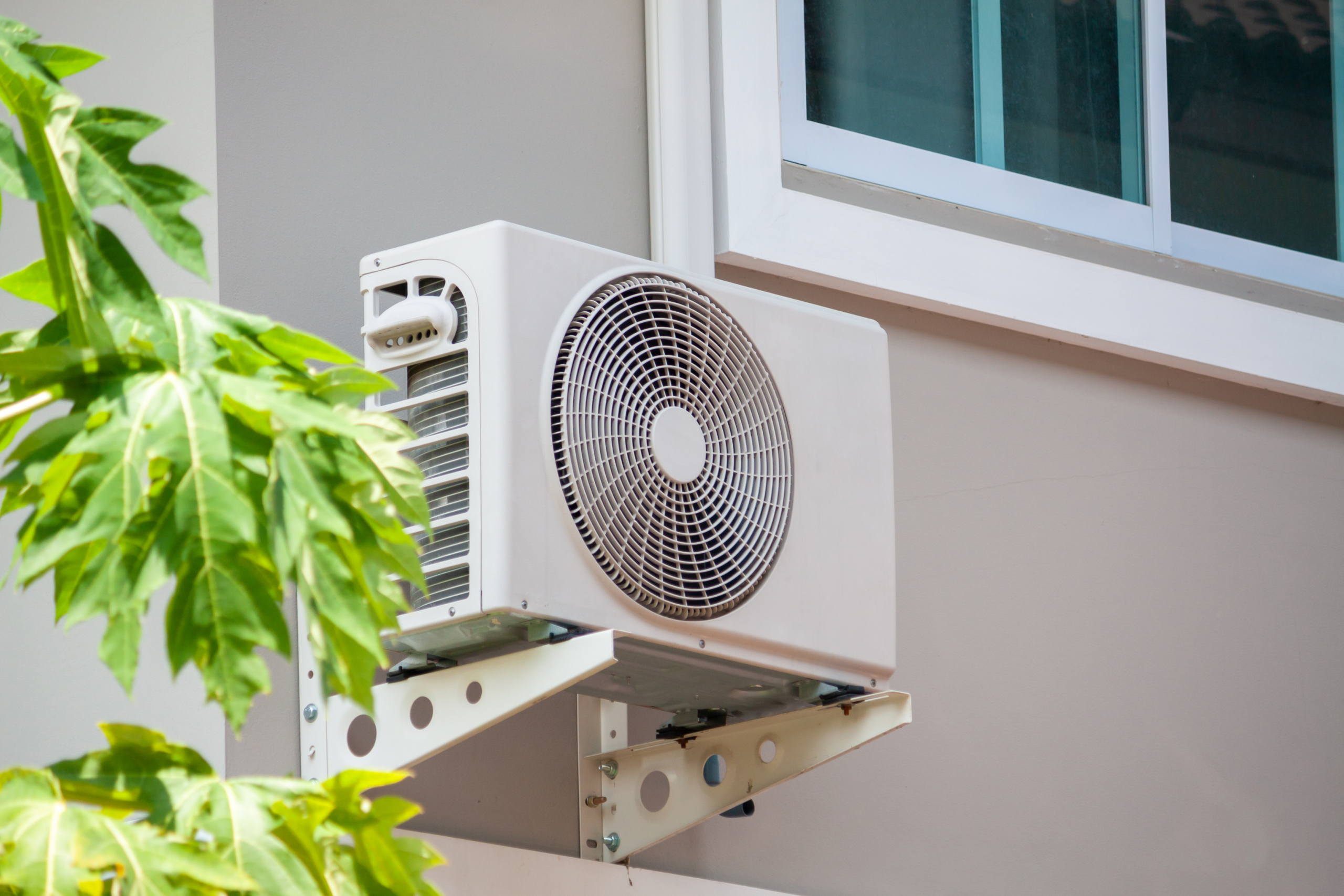 Air conditioner compressor outdoor unit installed outside the house